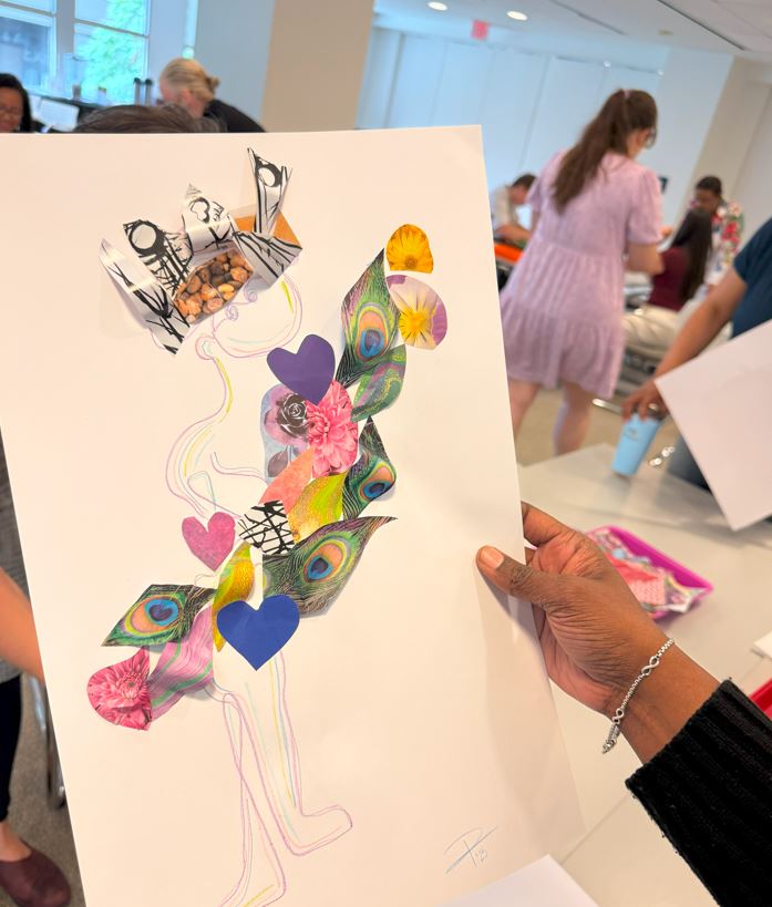 Someone holding up a collage artwork created during Pew workshop